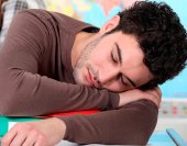 teen_boy_girl_asleep_school_shutterstock_91930403